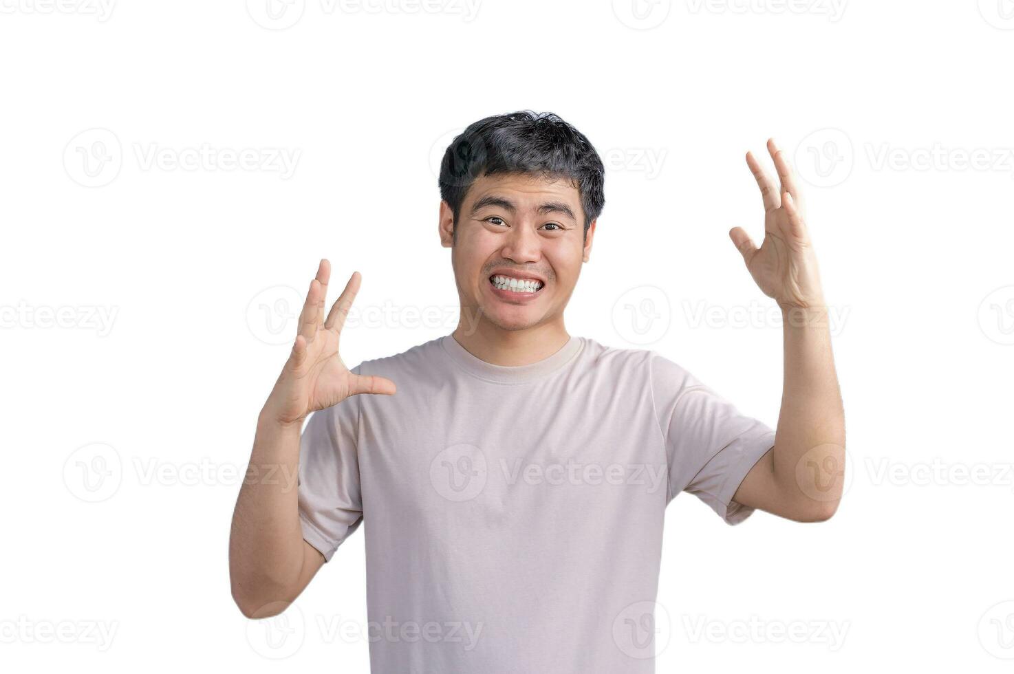 Portrait of angry or annoyed young Asian Thai man casual t-shirt looking at the camera with displeased expression. Negative human expressions, emotions, and feelings. Body language. photo