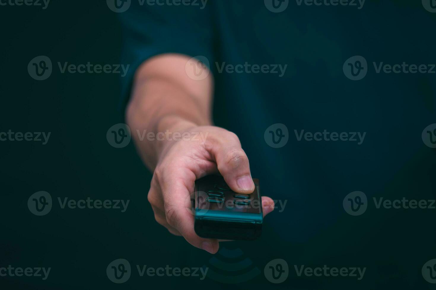 Concepts of using digital media, social media Surfing online, male hand using remote control To play or use social media, the concept of working remotely, working from home via the internet. photo