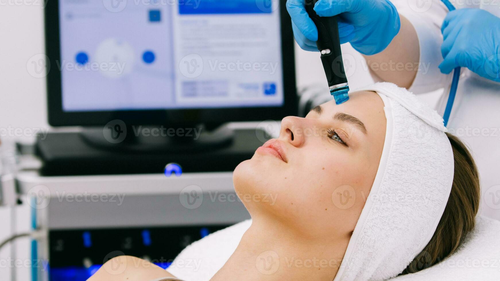 Face Skin Care. Close-up Of Woman Getting Facial Hydro Microdermabrasion Peeling Treatment At Cosmetic Beauty Spa Clinic. Hydra Vacuum Cleaner. Exfoliation, Rejuvenation And Hydratation. Cosmetology. photo