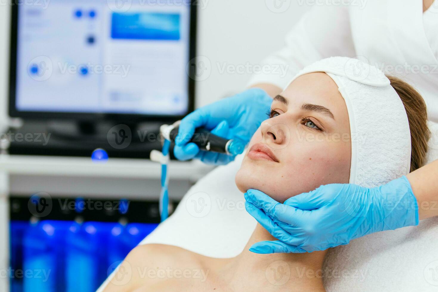 Face Skin Care. Close-up Of Woman Getting Facial Hydro Microdermabrasion Peeling Treatment At Cosmetic Beauty Spa Clinic. Hydra Vacuum Cleaner. Exfoliation, Rejuvenation And Hydratation. Cosmetology. photo
