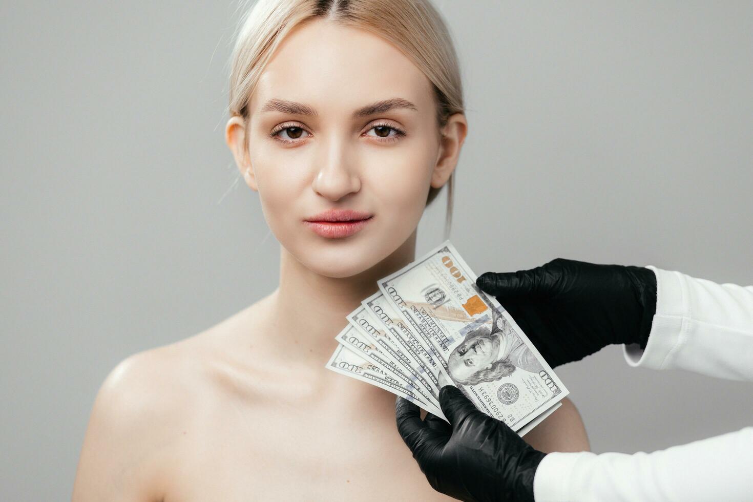 Business, finance and investment in cosmetology. Beautiful and sexy woman looking impressed is holding euro cash. Beauty salon concept photo