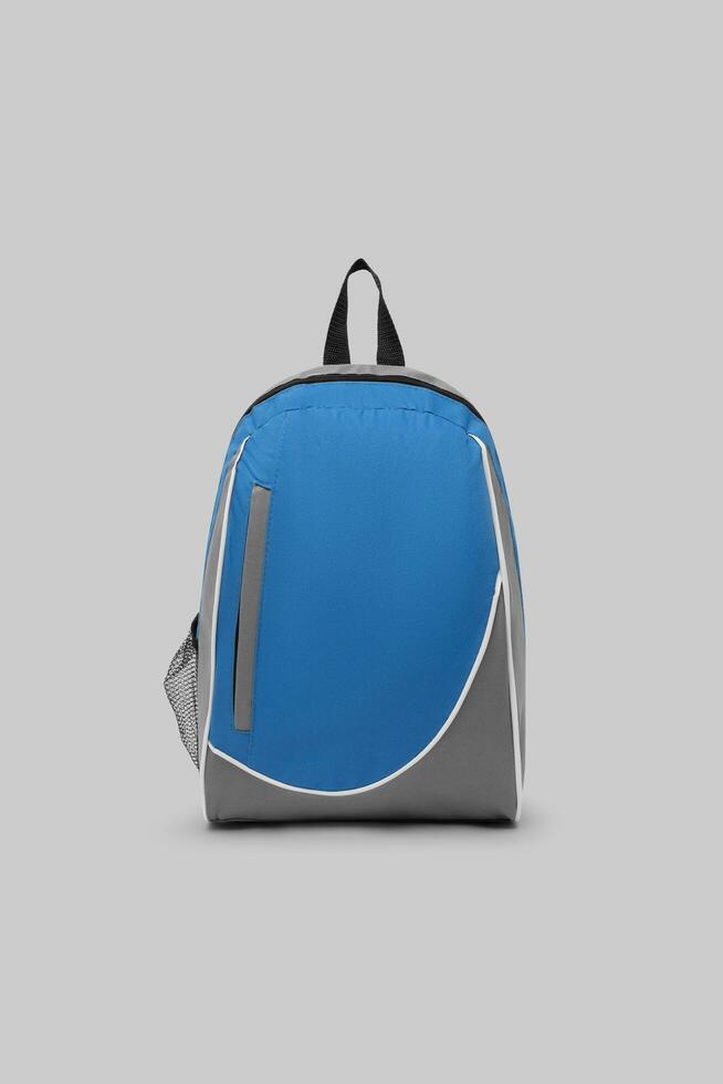 close up blank backpack with zipper and shoulder straps isolated on white background. travel day pack rucksack. folding nylon school backpack. top view. mock up. photo