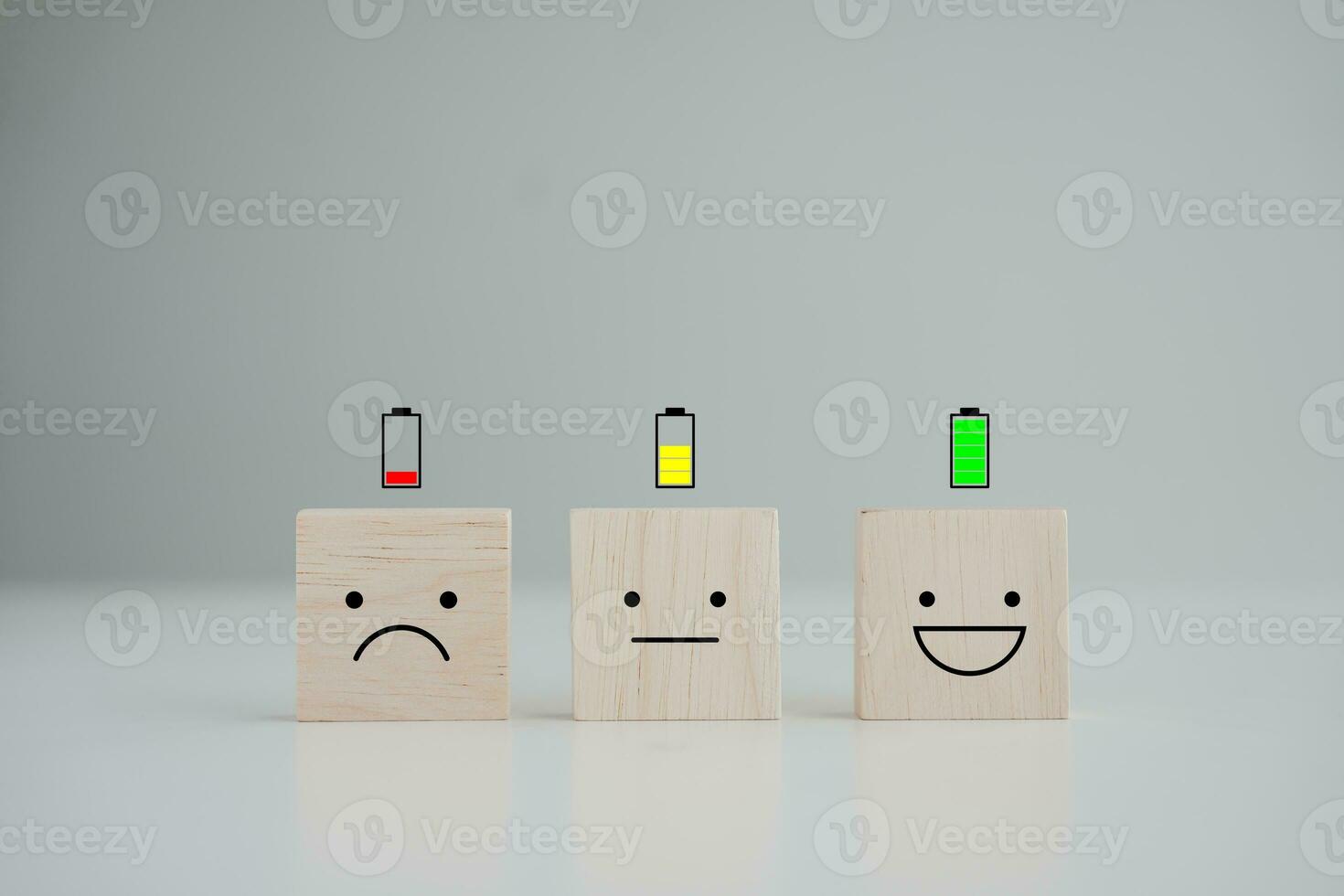 Energy life and emotion level. Happy smile face with full battery and unhappy face low battery on floor. Full energy, Passion, Happy Life, Emotion, positive thinking, world mental health day. photo