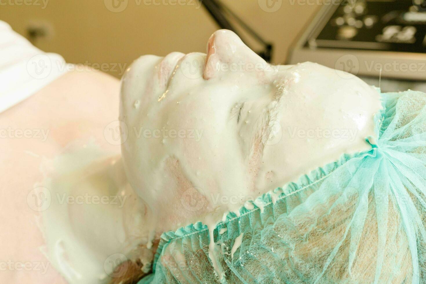 Collagen face mask . Facial skin treatment. Bottle with moisturizing cream photo