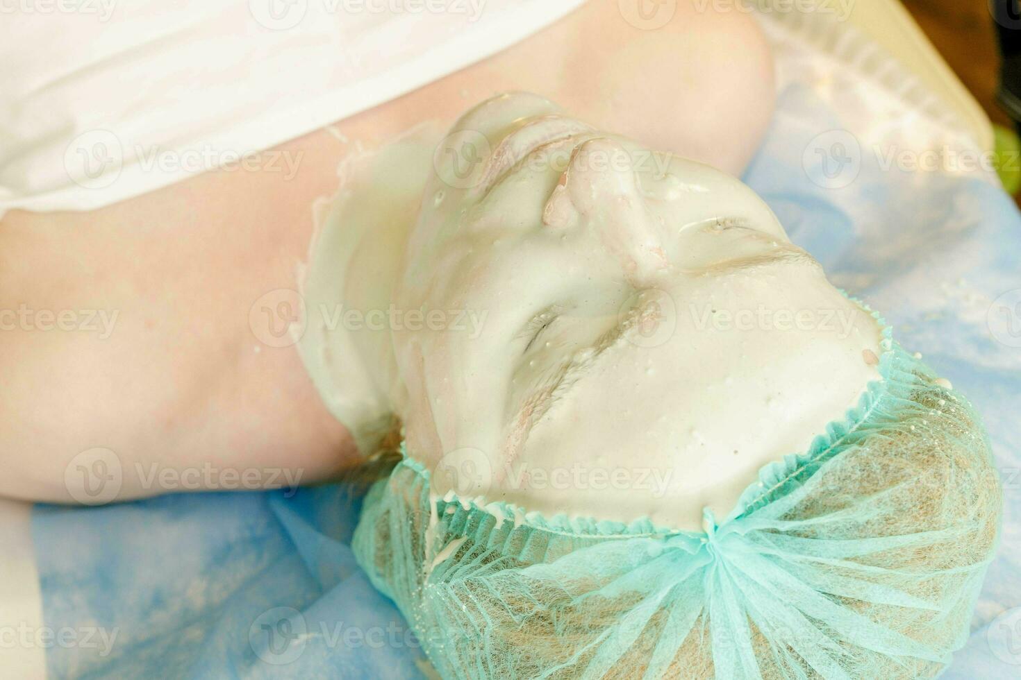 Collagen face mask . Facial skin treatment. Bottle with moisturizing cream photo