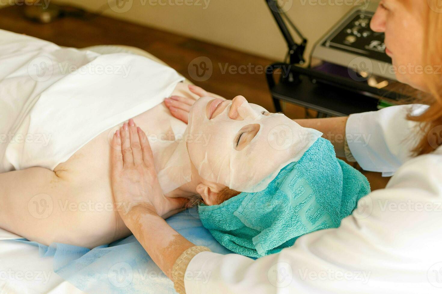 Collagen face mask . Facial skin treatment. Bottle with moisturizing cream photo