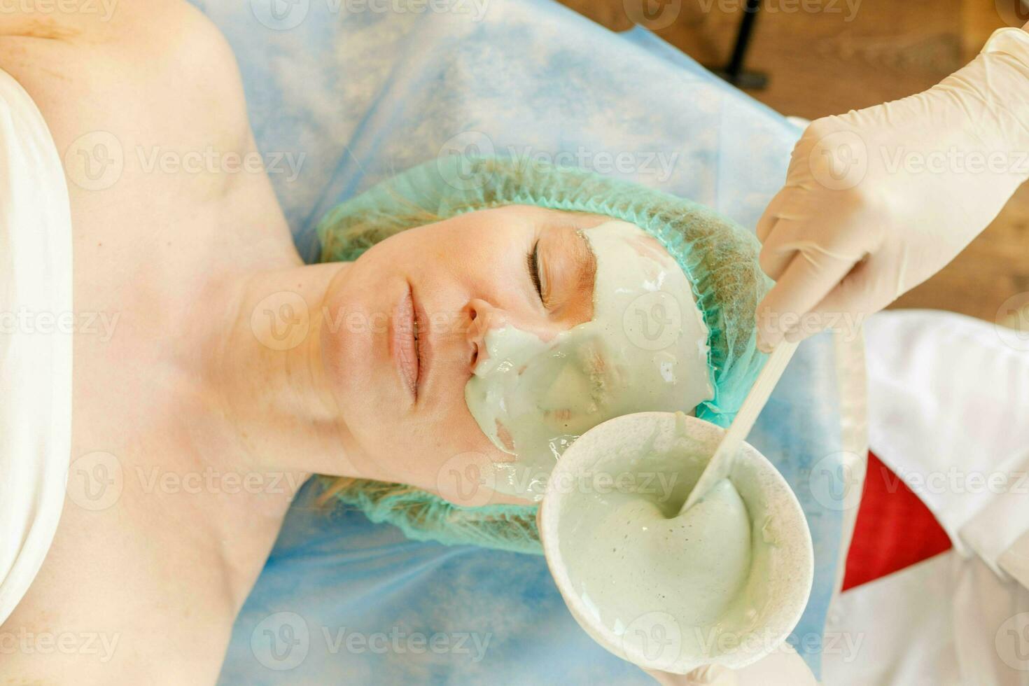 Collagen face mask . Facial skin treatment. Bottle with moisturizing cream photo