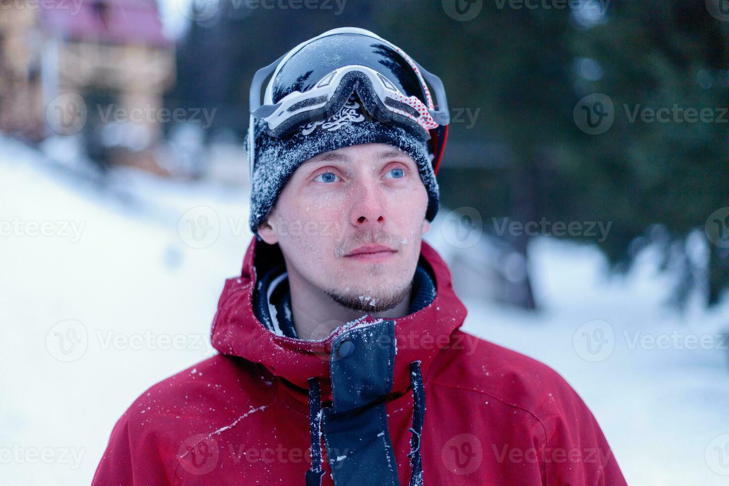 Man snowboarding in the mountains photo