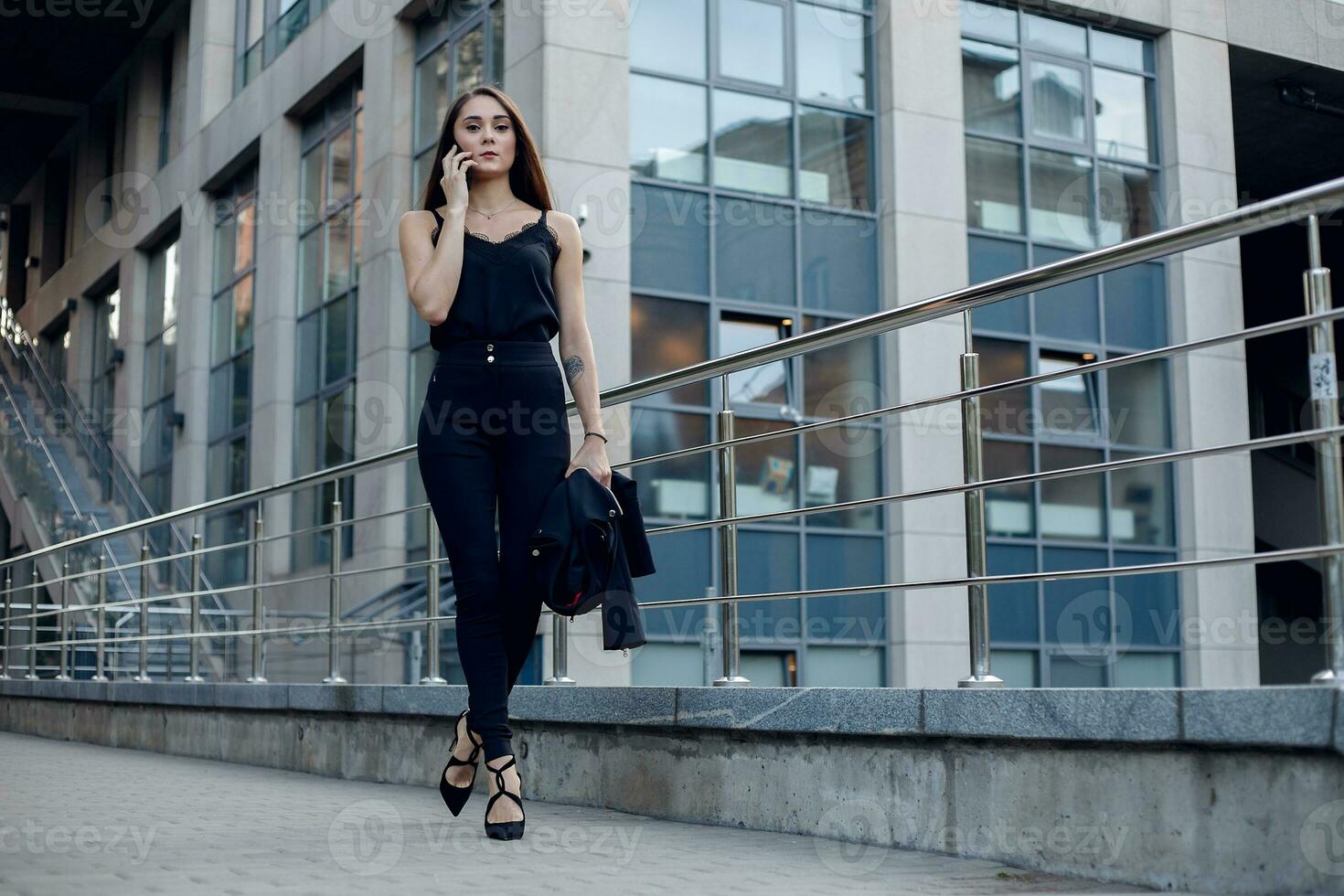 Business Woman With Phone Near Office. photo