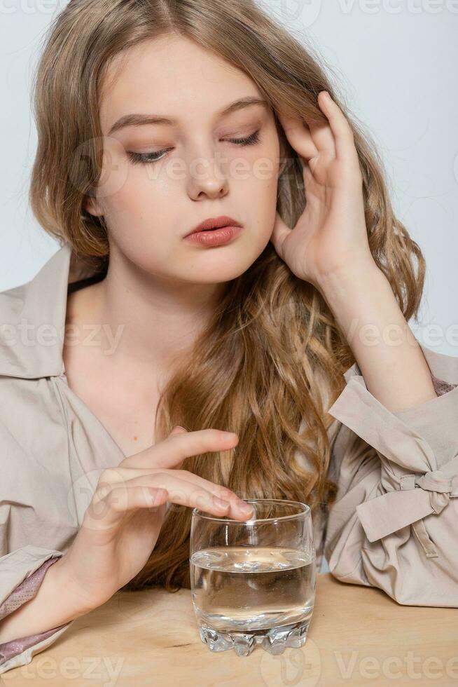 Smiling Young Woman with glass of Water photo