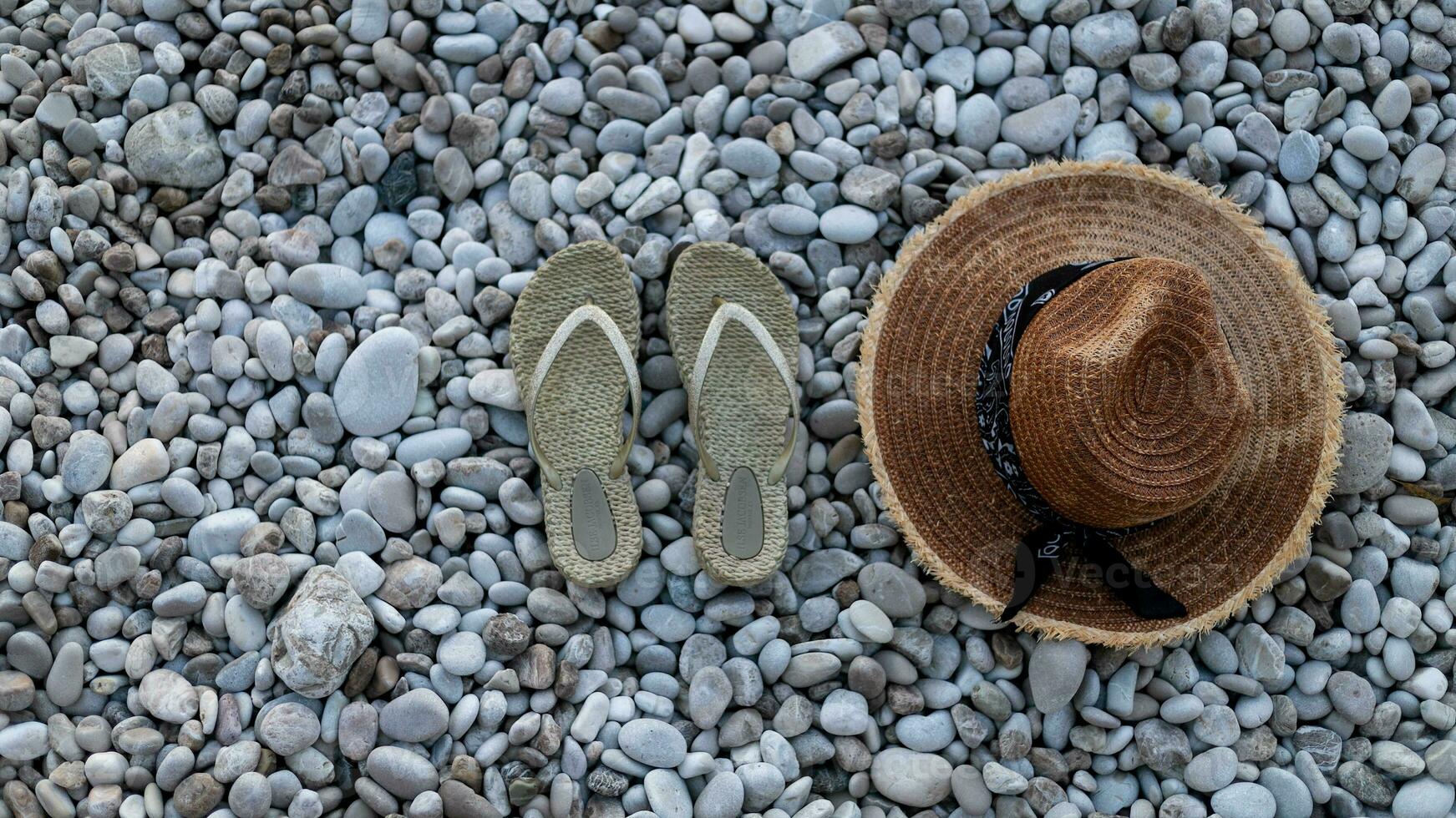 Travel vacation concept with flip flop sandals and beach staw photo