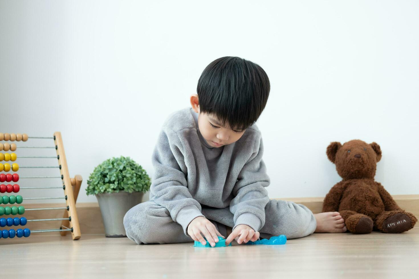 Asian boy having fun playing slam on the floor Learning outside the classroom photo