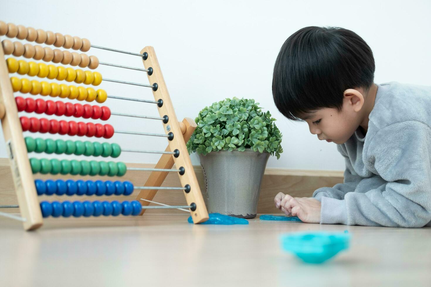 Asian boy having fun playing slam on the floor Learning outside the classroom photo