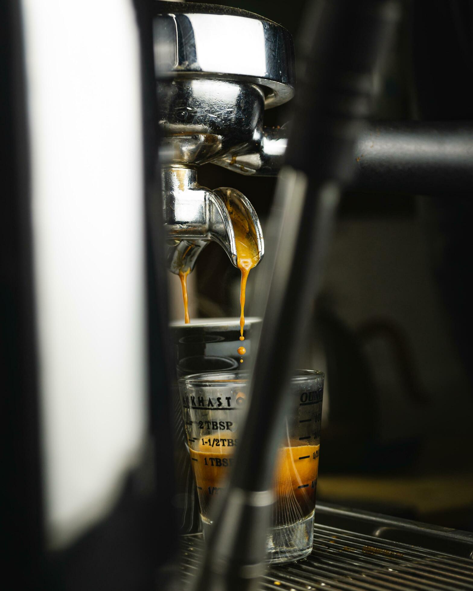 Espresso drip shot with double spout portafilter from coffee machine