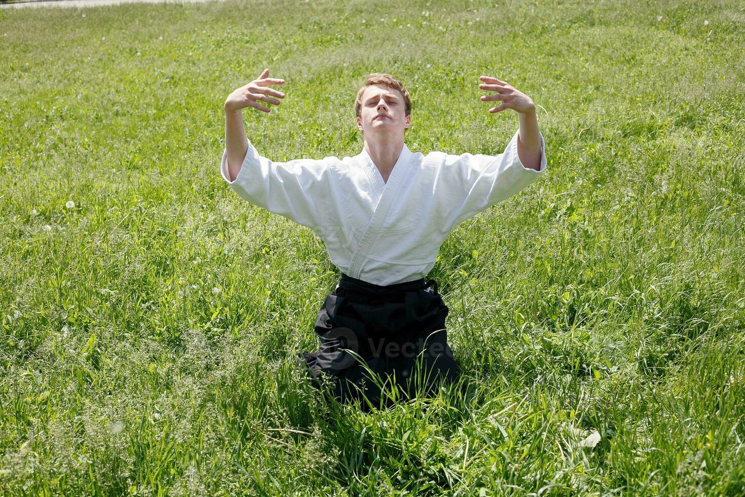 Close up Portrait of young Taekwondo man exercise photo