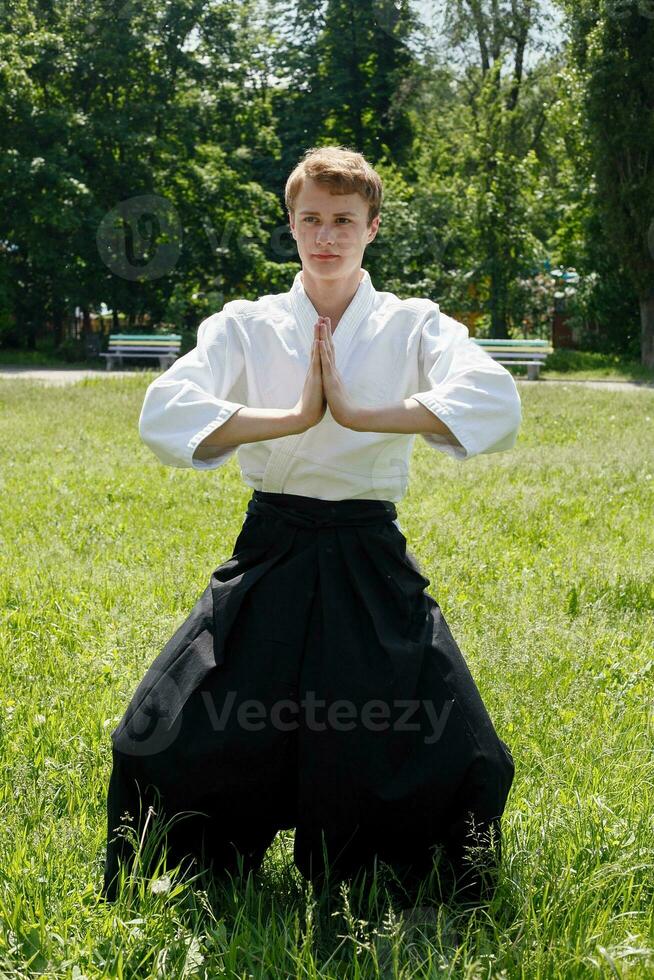 Close up Portrait of young Taekwondo man exercise photo