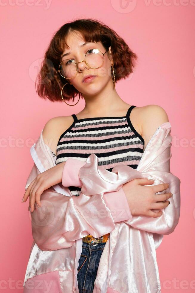 Image of young happy beautiful woman posing isolated over pink photo