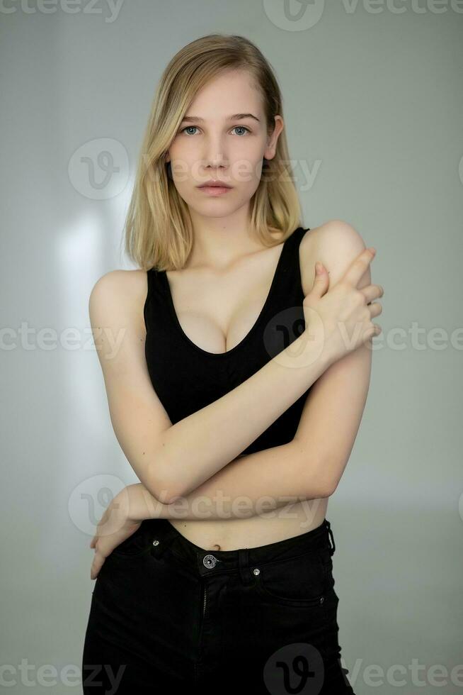 Portrait of a casual blonde woman in black top photo