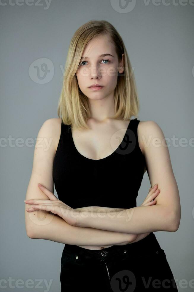 Portrait of a casual blonde woman in black top photo