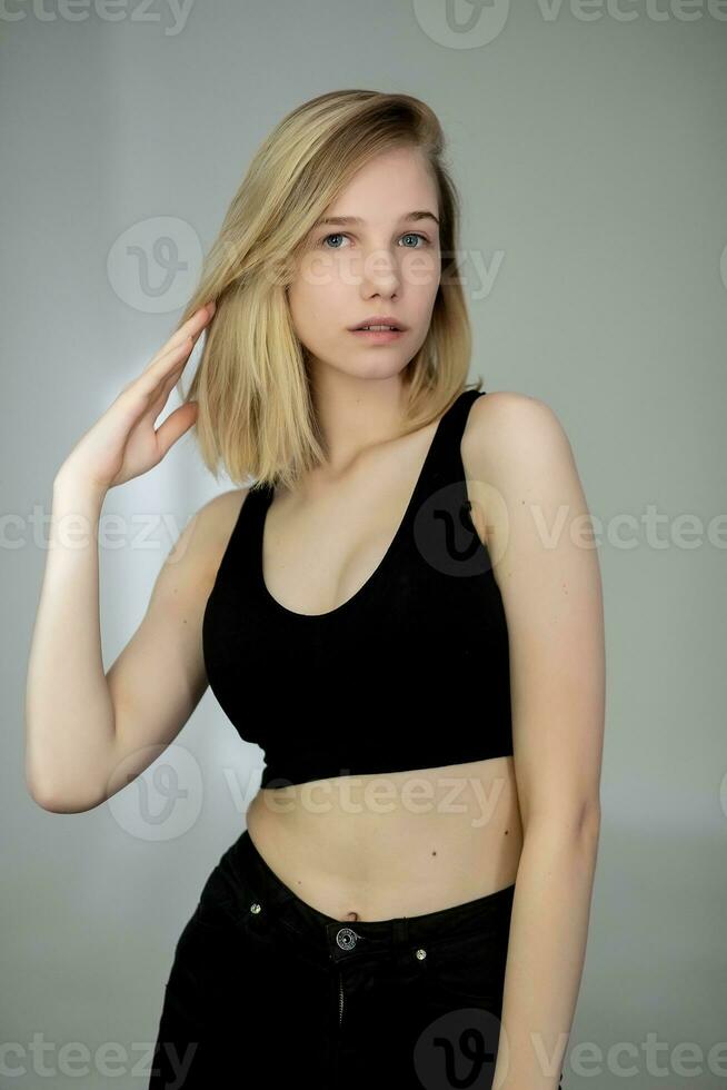 Portrait of a casual blonde woman in black top photo