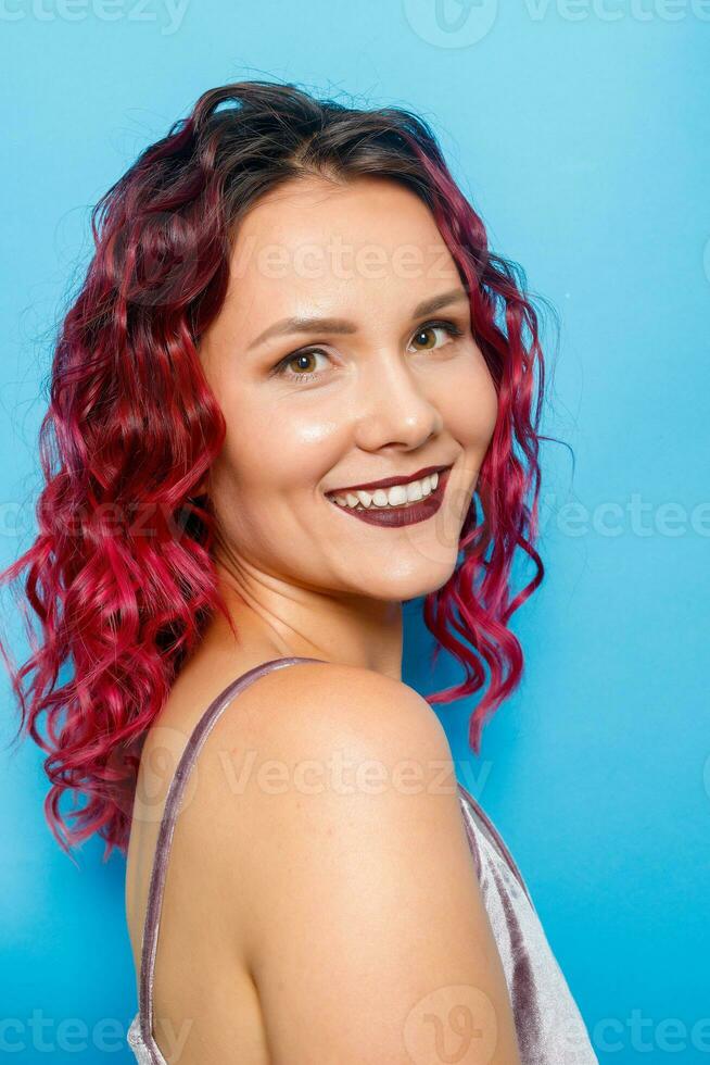 happy ginger red hair girl with freckles smiling looking at camera photo