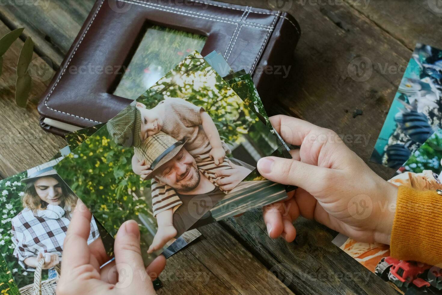 Photo printing. Woman looks at printed photos for family picture album.