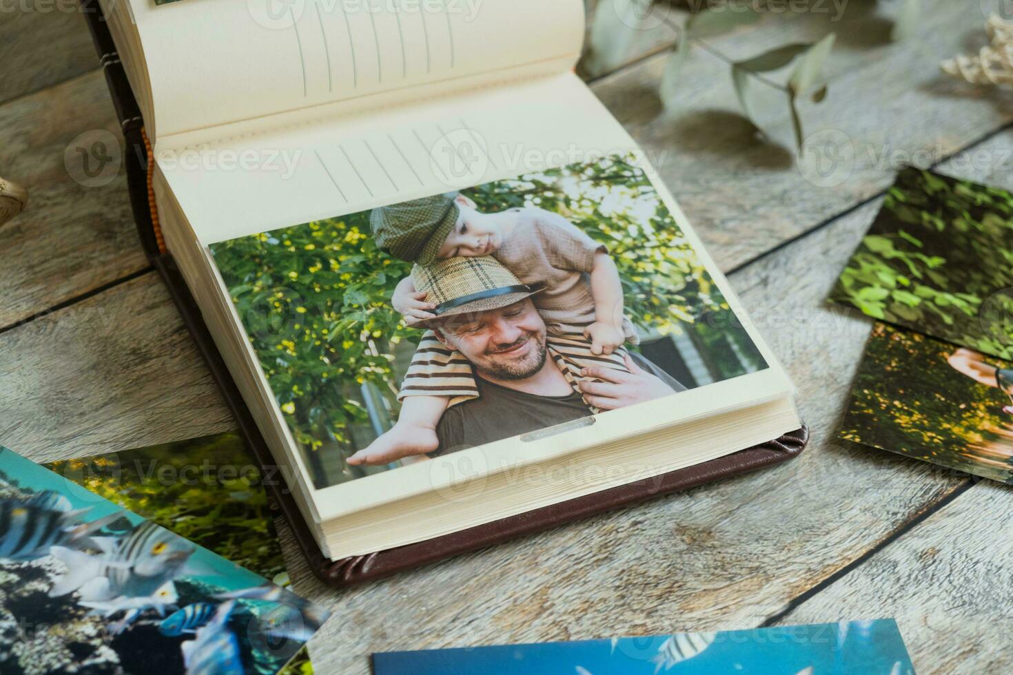 Printed photos in family picture album.