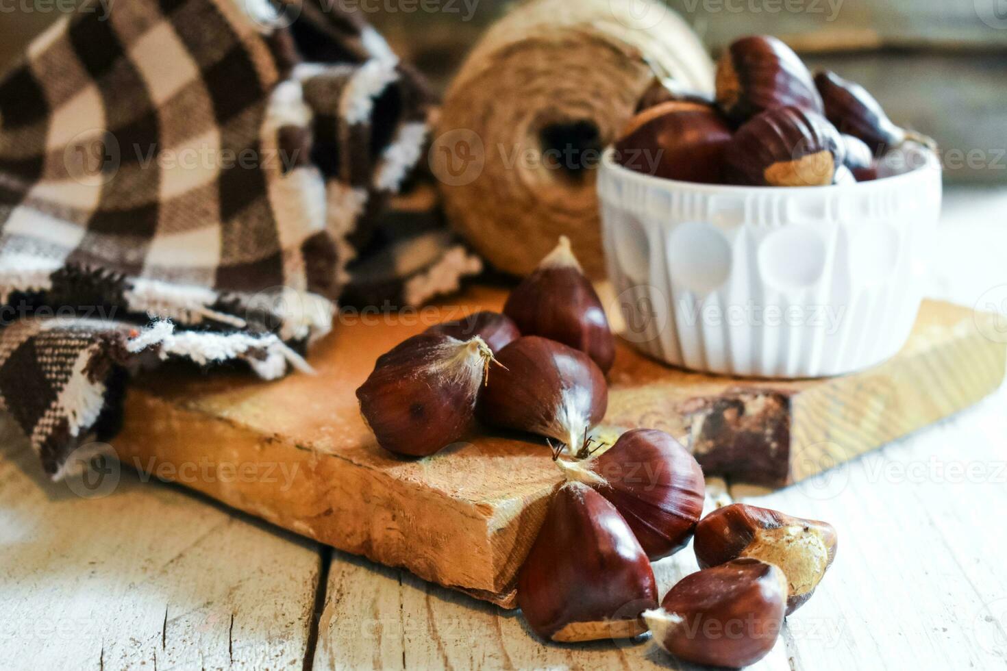 Chestnut on wooden Background photo