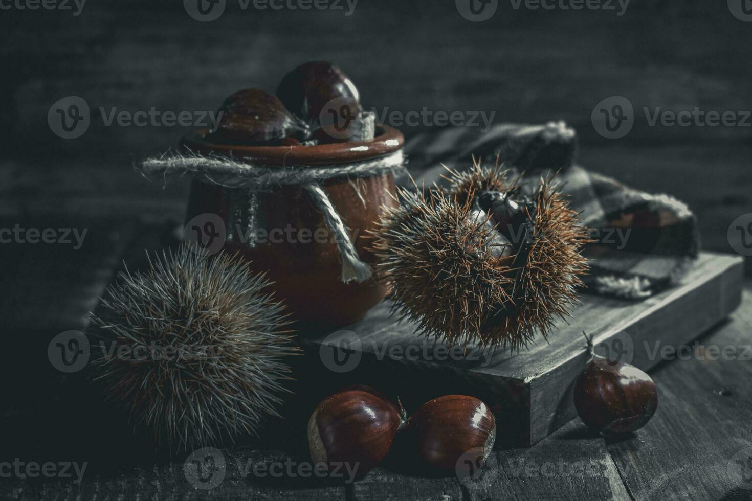 Chestnut on wooden Background photo