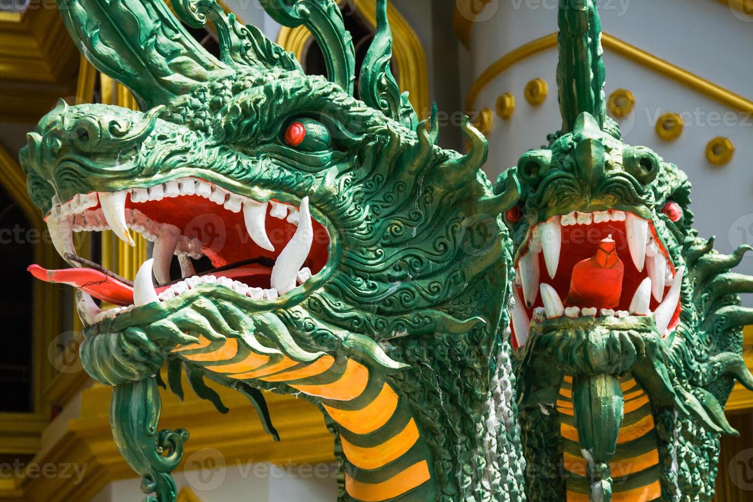 Green naka statue in front of Thai Buddhist pagoda at Tiger Cave Temple , Krabi , South of Thailand. photo