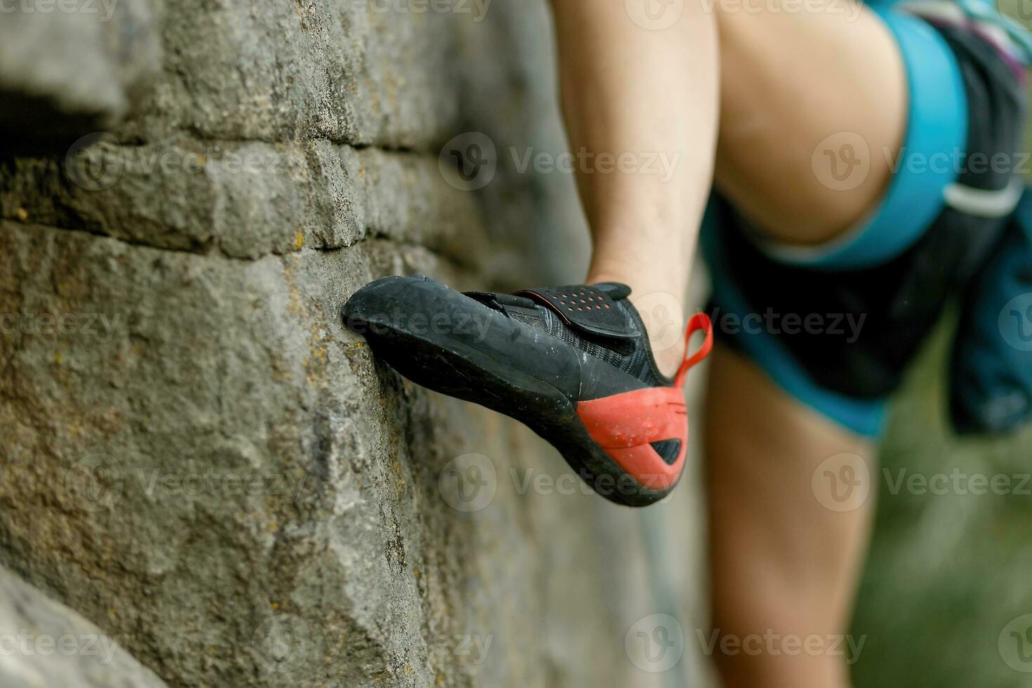 Rock climber about to start climbing his route photo