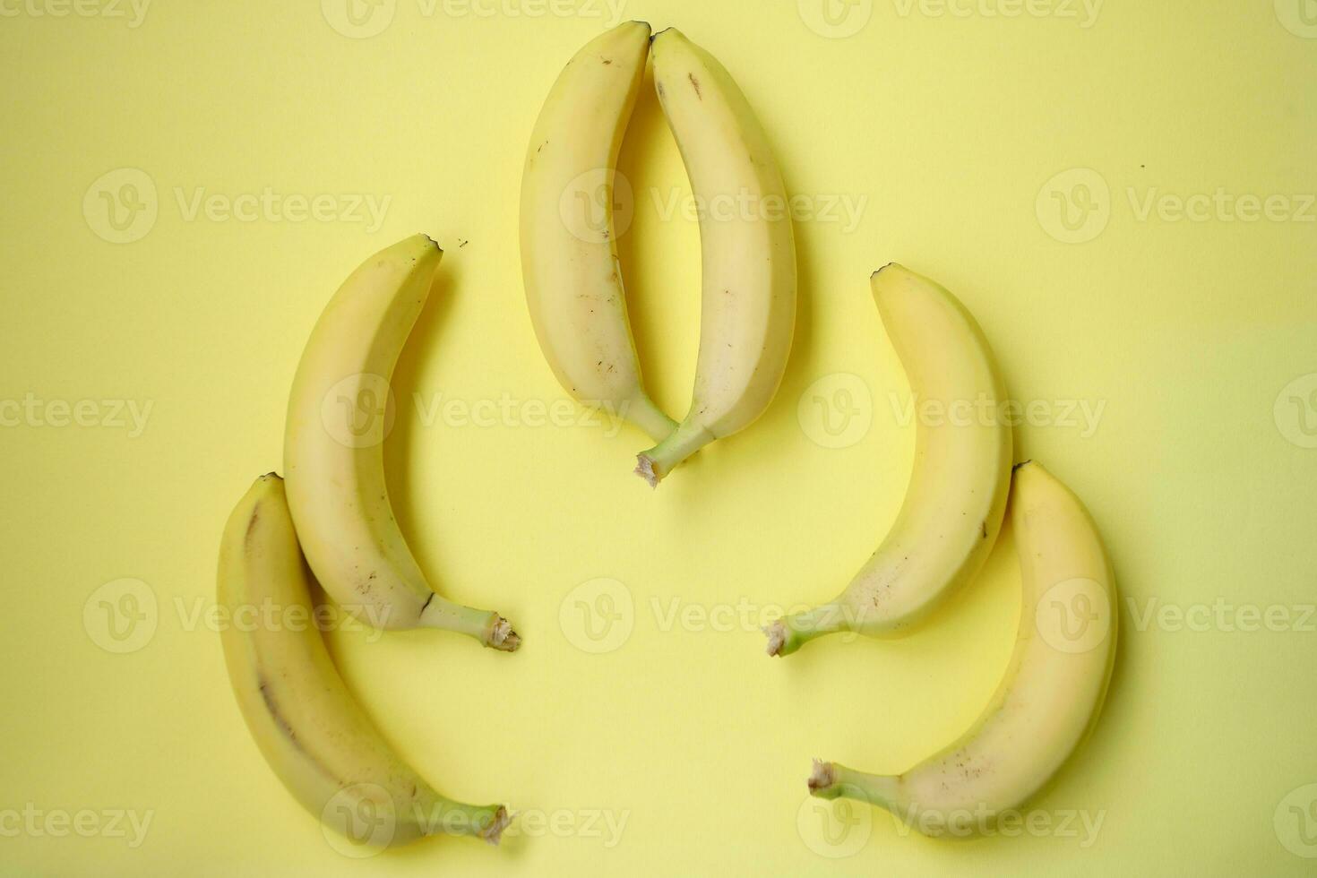 Fresh Banana on yellow background photo