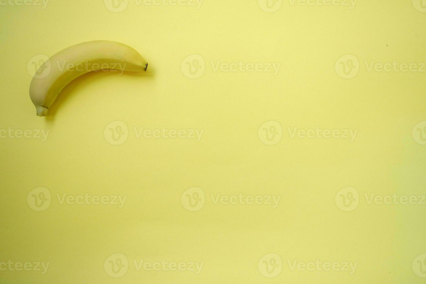 Fresh Banana on yellow background photo