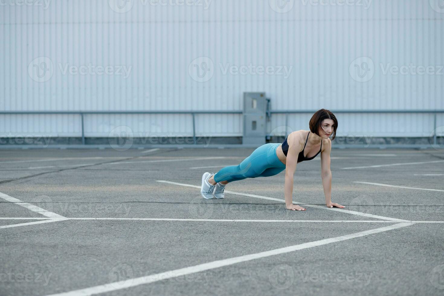 Young muscular woman doing core exercise. photo