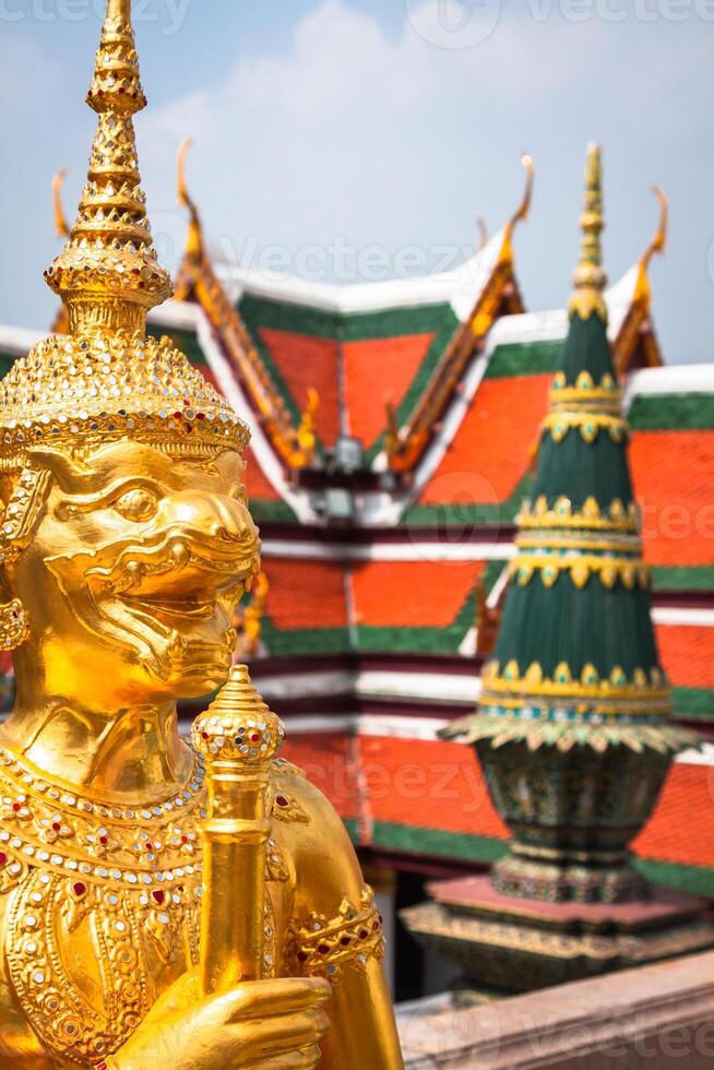 Golden Angle at Wat Phra Kaeo, Temple of the Emerald Buddha and the home of the Thai King. Wat Phra Kaeo is one of Bangkok's most famous tourist sites and it was built in 1782 at Bangkok, Thailand. photo