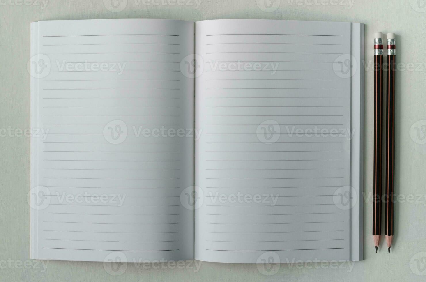 Notebook and Pencils General Stationery on White Background photo