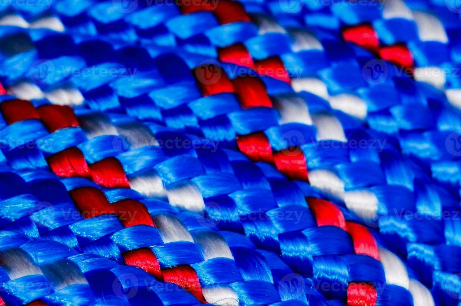 a close up of a blue, red and white braided rope photo