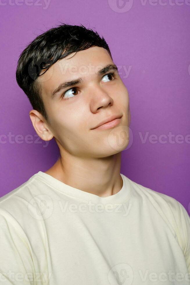 Indoor shot of handsome muscular guy with positive expression photo