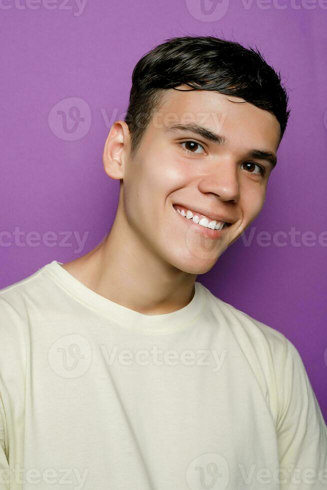 Indoor shot of handsome muscular guy with positive expression photo