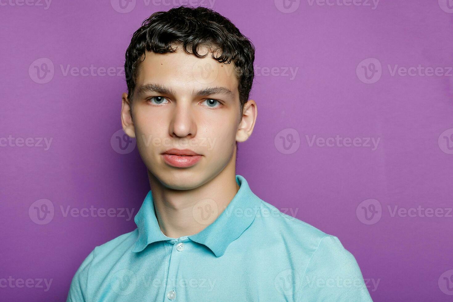 Indoor shot of handsome muscular guy with positive expression photo