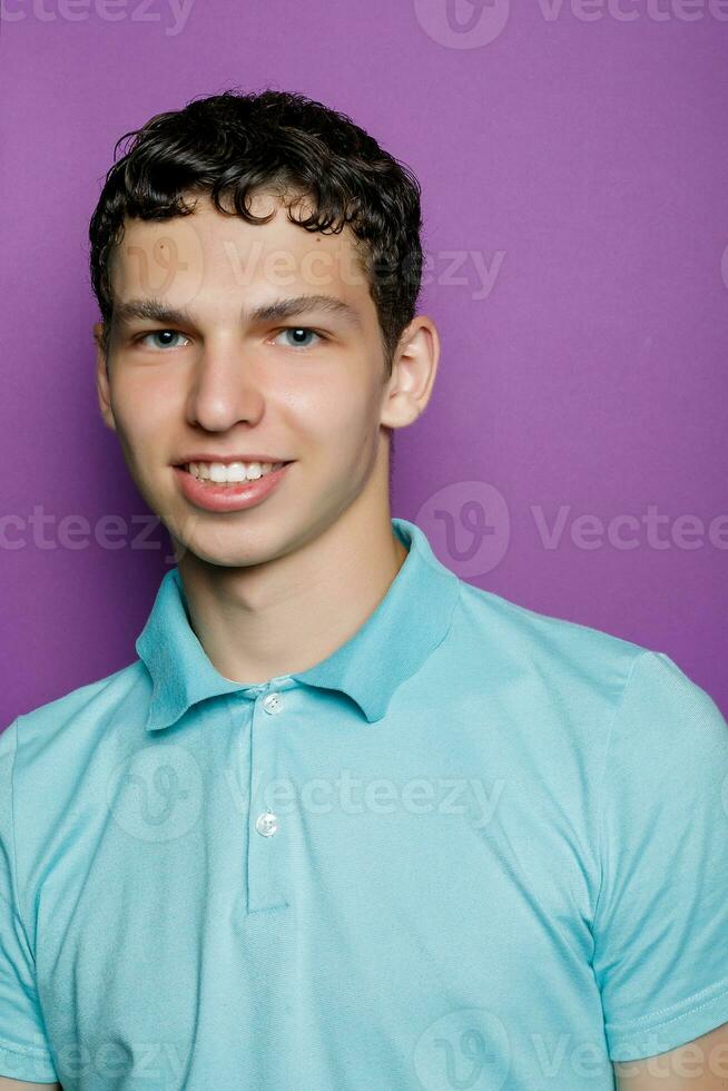 Indoor shot of handsome muscular guy with positive expression photo