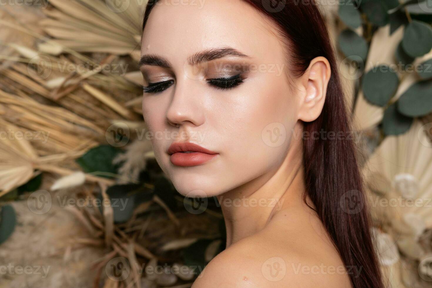 Closeup portrait of young beautiful woman with a healthy skin of the face. photo