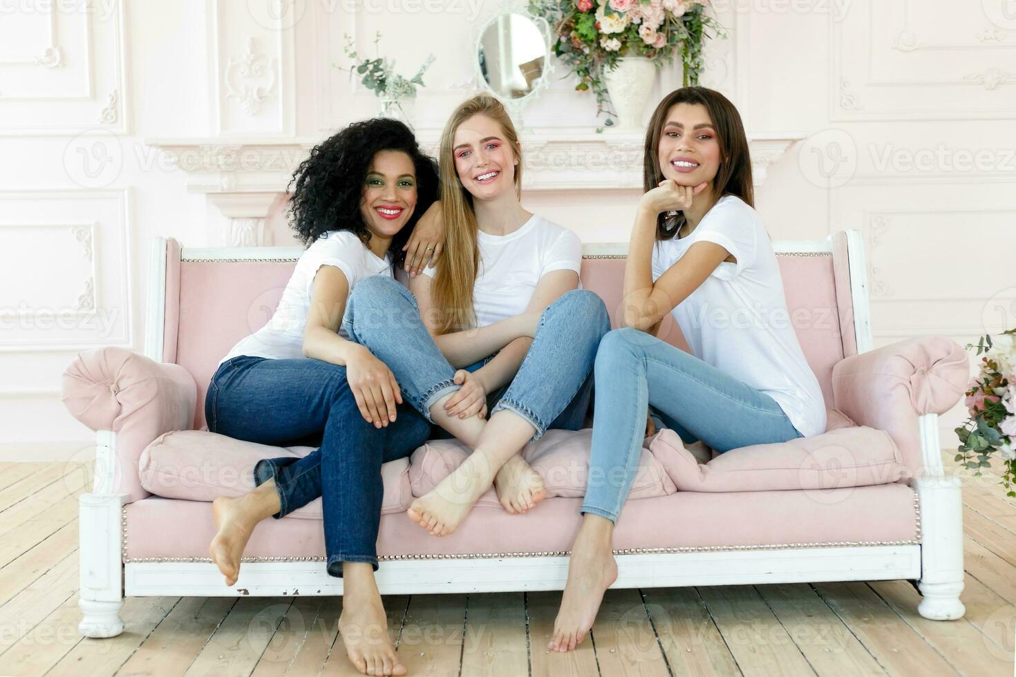 three girlfriends having a talk at home photo
