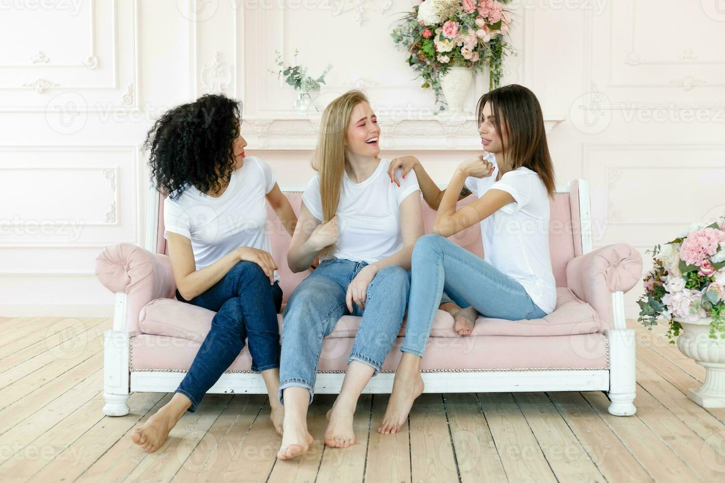 three girlfriends having a talk at home photo