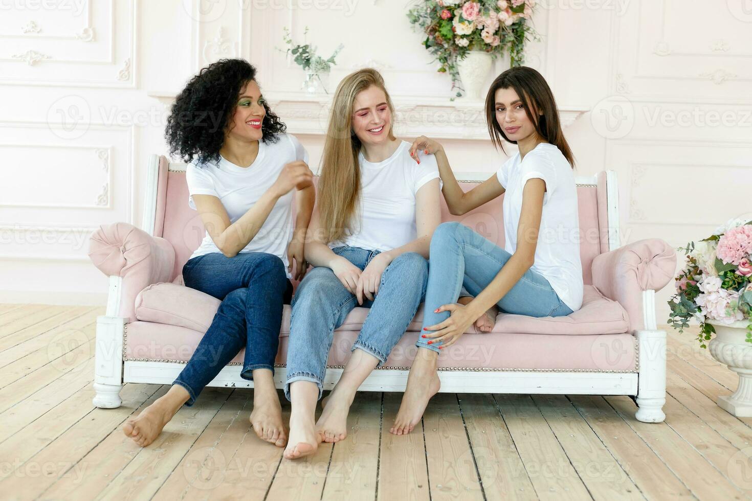 three girlfriends having a talk at home photo