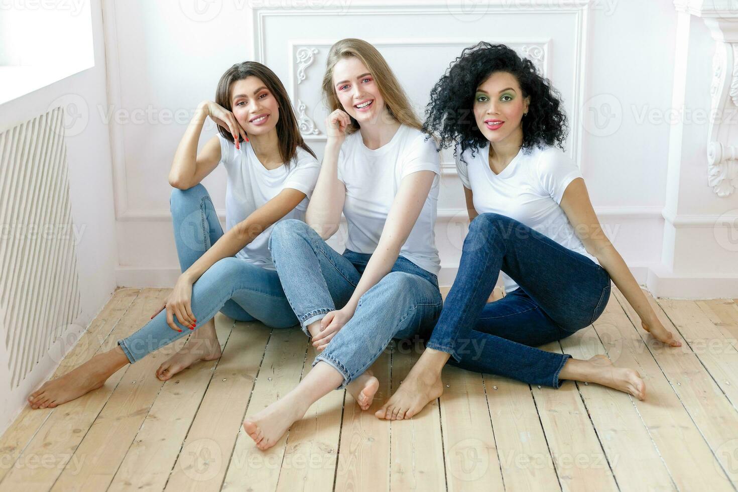 three girlfriends having a talk at home photo