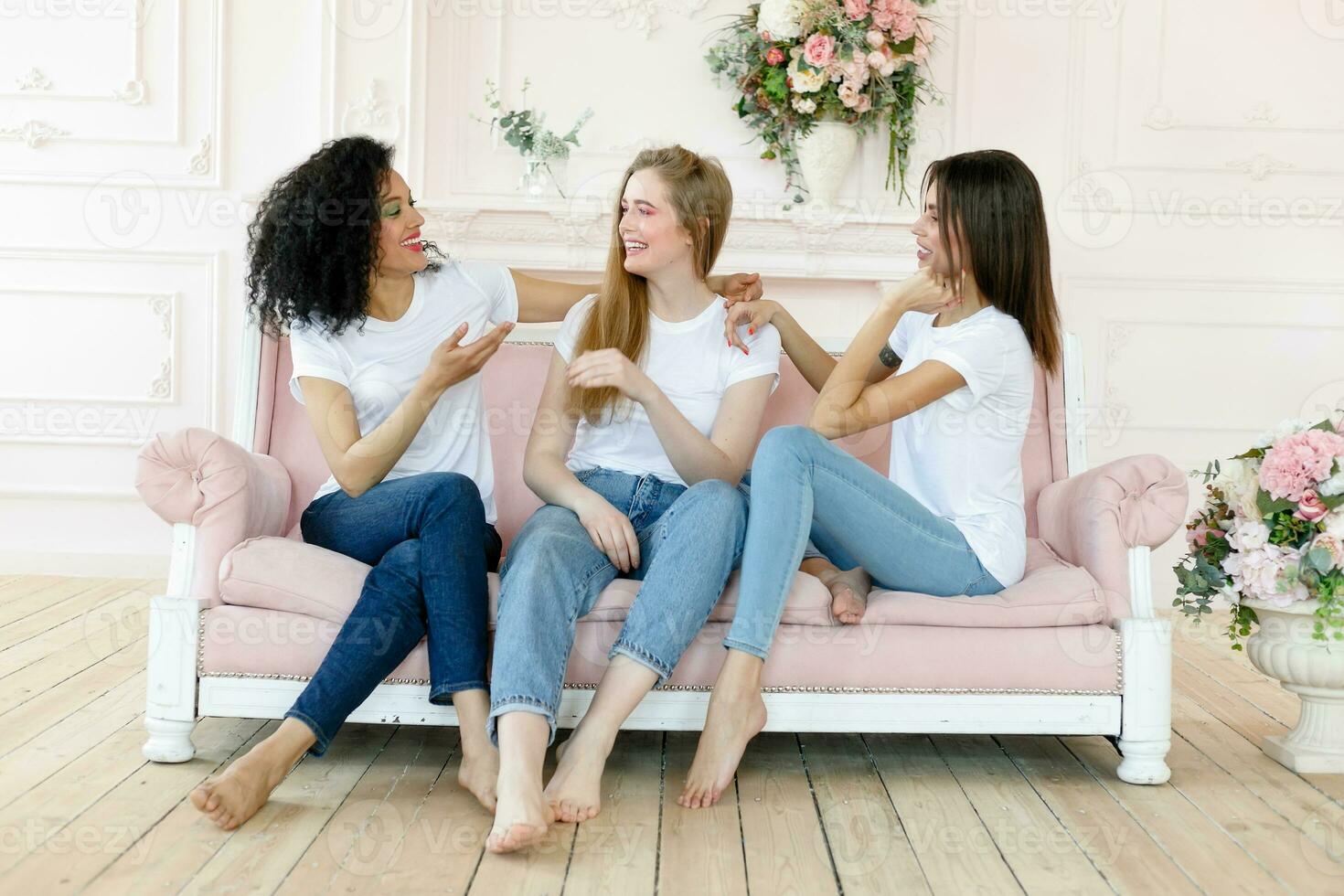 three girlfriends having a talk at home photo