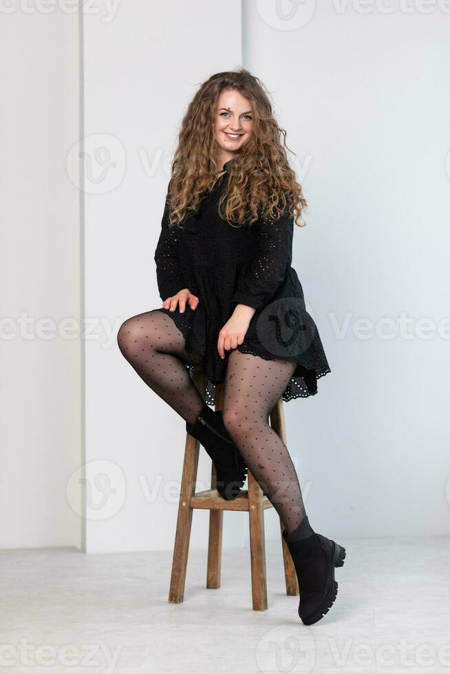 young not thin girl in a black dress. photo