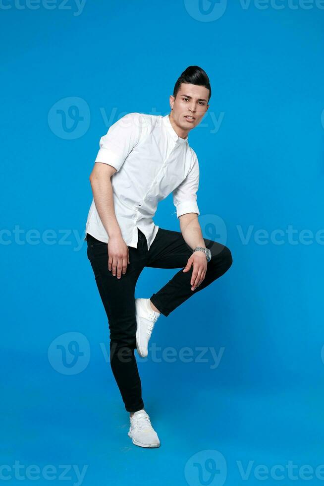 Handsome man wear black leather jacket. full length photo of a young casual man