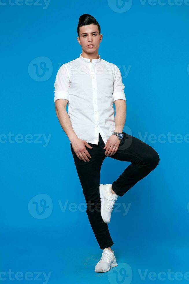 Handsome man wear black leather jacket. full length photo of a young casual man